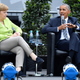 Former President Barack Obama and German Chancellor Angela Merkel at the Brandenburg Gate during the Church Congress on May 25, 2017, in Berlin (Alexander Koerner/Getty Images)